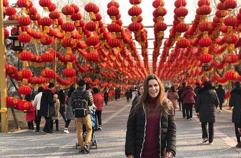 Student standing in front of lanterns_s8Sp2a2w